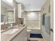 Clean bathroom with granite countertop, white cabinets, and shower-tub combo with glass door at 1250 W Marion Ave # 333, Punta Gorda, FL 33950