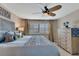 Comfortable bedroom featuring a ceiling fan, natural light from the windows, and soothing decor at 1250 W Marion Ave # 333, Punta Gorda, FL 33950