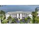 Beautiful waterfront condo with a large balcony and lush landscaping, providing stunning views of the bay at 1250 W Marion Ave # 333, Punta Gorda, FL 33950