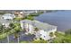 Three-story condo building featuring balconies and lush landscaping, near waterfront views at 1250 W Marion Ave # 333, Punta Gorda, FL 33950