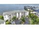 Attractive condo complex with multiple balconies, verdant palms, and covered parking for residents and their guests at 1250 W Marion Ave # 333, Punta Gorda, FL 33950