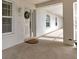 Inviting condo hallway with a unit entrance framed by arched windows and access to well-lit stairwells at 1250 W Marion Ave # 333, Punta Gorda, FL 33950