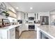 Well-lit kitchen featuring stainless steel appliances, and white cabinets at 1250 W Marion Ave # 333, Punta Gorda, FL 33950