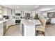 Bright kitchen with white cabinets, stainless steel appliances, and breakfast bar seating at 1250 W Marion Ave # 333, Punta Gorda, FL 33950