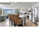 Island kitchen and wine rack, with a stunning view from the window and comfortable seating around the island at 1250 W Marion Ave # 333, Punta Gorda, FL 33950