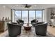 Comfortable living area with four chairs and large windows offering stunning water views at 1250 W Marion Ave # 333, Punta Gorda, FL 33950