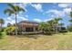 Expansive backyard with screened pool, mature trees, and space for recreation at 13139 Preserve Ct, Port Charlotte, FL 33953