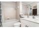 Bright bathroom with a shower-tub combo and modern white vanity with sink at 13139 Preserve Ct, Port Charlotte, FL 33953