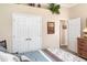 Cozy bedroom featuring ample closet space, neutral walls, and carpet flooring at 13139 Preserve Ct, Port Charlotte, FL 33953