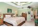 Spacious bedroom with tray ceiling, carpet flooring, and stylish decor at 13139 Preserve Ct, Port Charlotte, FL 33953
