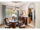 Charming dining room featuring a wooden table set with chairs, and a buffet at 13139 Preserve Ct, Port Charlotte, FL 33953