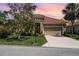 Beautiful single-story home featuring a tile roof, manicured landscaping, and a two-car garage at 13139 Preserve Ct, Port Charlotte, FL 33953