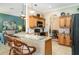 Open concept kitchen featuring an island with granite countertops and pendant lighting at 13139 Preserve Ct, Port Charlotte, FL 33953