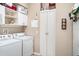 Functional laundry room with a washing machine and dryer hookups plus ample storage space at 13139 Preserve Ct, Port Charlotte, FL 33953