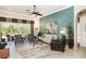 Bright living room showcasing stylish furnishings, tile floors, and views of the pool at 13139 Preserve Ct, Port Charlotte, FL 33953