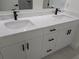 Bright double vanity bathroom featuring dual sinks and modern fixtures at 136 Sequoyah Dr, Port Charlotte, FL 33954
