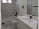 Modern bathroom with sleek single vanity, shower and tub combination at 136 Sequoyah Dr, Port Charlotte, FL 33954