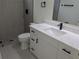 Bathroom featuring a sink, toilet, glass-enclosed shower and modern finishes at 136 Sequoyah Dr, Port Charlotte, FL 33954