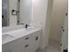 Bathroom featuring double sinks, modern fixtures, and quartz countertops at 136 Sequoyah Dr, Port Charlotte, FL 33954