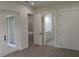 Bright bedroom features a walk-in closet, ensuite bathroom, and access to outdoor space at 136 Sequoyah Dr, Port Charlotte, FL 33954