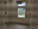Bedroom with neutral walls and two windows providing natural light at 136 Sequoyah Dr, Port Charlotte, FL 33954