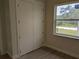This bedroom features ample closet space and a bright window at 136 Sequoyah Dr, Port Charlotte, FL 33954