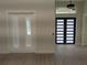 Bright foyer with double closet, modern front door, and luxury vinyl plank flooring at 136 Sequoyah Dr, Port Charlotte, FL 33954