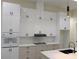 Bright kitchen showcasing stylish cabinetry, countertops, and modern appliances at 136 Sequoyah Dr, Port Charlotte, FL 33954