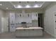 Contemporary kitchen featuring white cabinets, pendant lighting, and a center island at 136 Sequoyah Dr, Port Charlotte, FL 33954