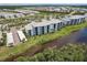Waterfront community aerial highlights a building with picturesque water views and lush landscape at 14141 Heritage Landing Blvd # 921, Punta Gorda, FL 33955