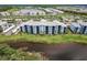 Community aerial displaying lovely building nestled along scenic waterway, offering charming vistas at 14141 Heritage Landing Blvd # 921, Punta Gorda, FL 33955