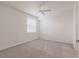Bright bedroom with neutral carpet, ceiling fan and natural light from the window at 14141 Heritage Landing Blvd # 921, Punta Gorda, FL 33955