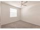 Bright bedroom with neutral carpet, ceiling fan and natural light from the window at 14141 Heritage Landing Blvd # 921, Punta Gorda, FL 33955