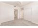 Bright bedroom with ensuite bathroom, closet, ceiling fan, and neutral carpet at 14141 Heritage Landing Blvd # 921, Punta Gorda, FL 33955