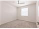 Bright bedroom with neutral carpet, ceiling fan and natural light from the window at 14141 Heritage Landing Blvd # 921, Punta Gorda, FL 33955