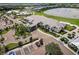 Aerial captures the gorgeous clubhouse showcasing sophisticated architecture and manicured landscape at 14141 Heritage Landing Blvd # 921, Punta Gorda, FL 33955