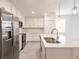 Beautiful bright kitchen featuring white cabinets, granite countertops, and stainless steel appliances at 14141 Heritage Landing Blvd # 921, Punta Gorda, FL 33955