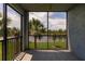 Relaxing screened patio boasts serene lake view through black railing, inviting outdoor enjoyment at 14141 Heritage Landing Blvd # 921, Punta Gorda, FL 33955