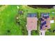 Aerial view of homes showcasing landscaping and rooflines, set in a lush green environment at 170 Antilla Dr, Rotonda West, FL 33947