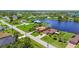 Desirable waterfront neighborhood offering well maintained lawns and tranquil water views from above at 170 Antilla Dr, Rotonda West, FL 33947