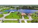 Waterfront homes with well manicured lawns offering serene water views in a desirable neighborhood at 170 Antilla Dr, Rotonda West, FL 33947