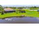 Peaceful backyard featuring screened lanai, private dock, and tranquil pond views, perfect for relaxing at 170 Antilla Dr, Rotonda West, FL 33947