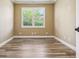 Bedroom featuring luxury tile flooring and plantation shutters at 170 Antilla Dr, Rotonda West, FL 33947