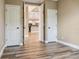 Open bedroom showcasing an open doorway to kitchen and other bedrooms at 170 Antilla Dr, Rotonda West, FL 33947