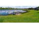 This home has a private dock on the lake with a fishing pier and grassy shoreline at 170 Antilla Dr, Rotonda West, FL 33947