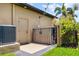 Exterior features a door to the outside and wood storage cabinet on a private outdoor patio at 170 Antilla Dr, Rotonda West, FL 33947