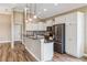 Stylish kitchen featuring granite countertops, white cabinets, stainless steel appliances, and an open design at 170 Antilla Dr, Rotonda West, FL 33947