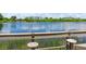 Enjoy lake views from this fishing dock with built-in bar top and bar stools at 170 Antilla Dr, Rotonda West, FL 33947