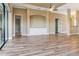 Spacious living room featuring wood-look tile flooring, and a built-in entertainment center at 170 Antilla Dr, Rotonda West, FL 33947