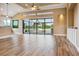 Open living space with wood floors and water views, plus a kitchen area at 170 Antilla Dr, Rotonda West, FL 33947